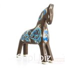 A bay horse with a pattern of blue and white swirls