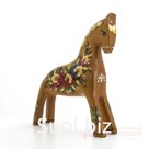 A bay horse with a bouquet and a wavy mane