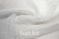 Прозрачная вуаль молочного цвета с вышитым рисунком в виде тонких вертикальных полос серебристого цвета. Высота полотна 280 см. АРТИКУЛ S180.