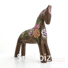 A dun horse with peonies