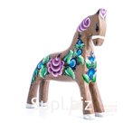 A chestnut horse with a fuchsia flower