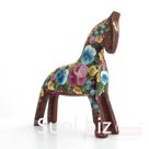 Dark red horse with summer flowers